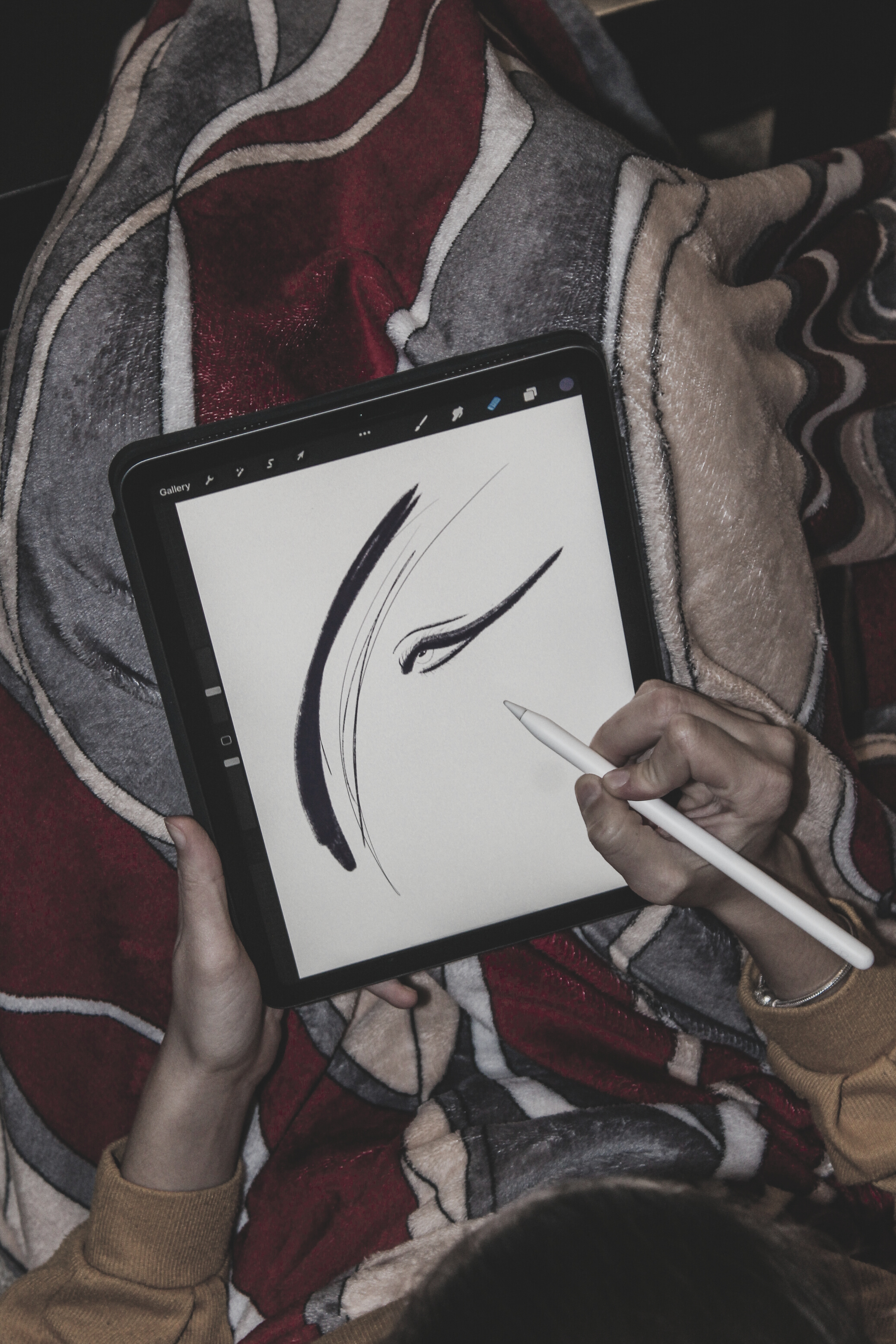 A Person Drawing on a Digital Tablet